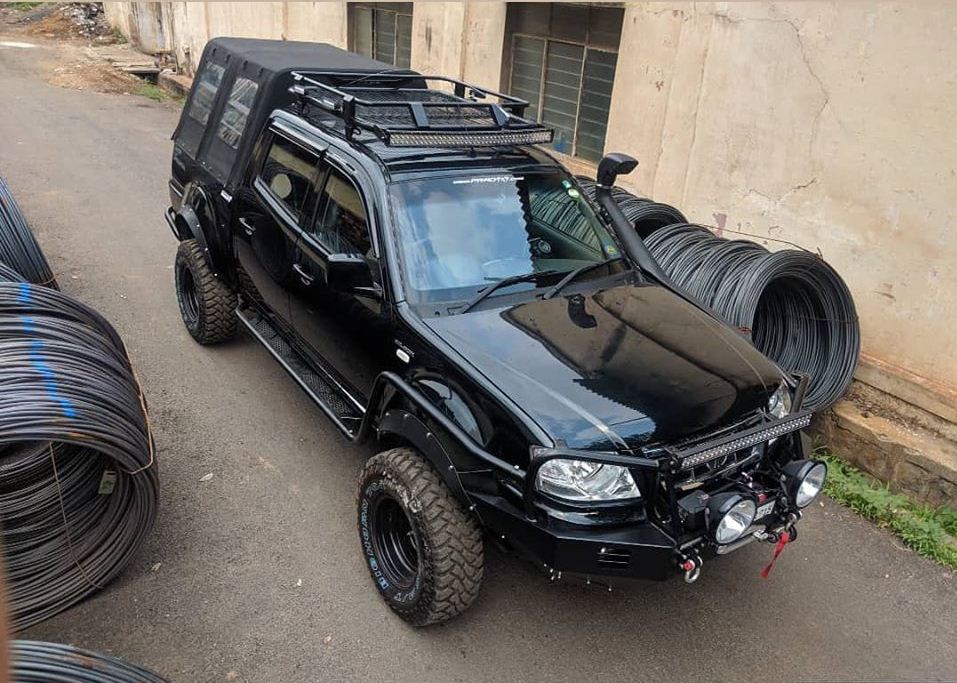 Spec - Tata Xenon 3.0ltr, Prad4x4™ - Winch compatible XPD Bumper with DRL and 28inch lightbar, Fender Protection, Connecting Rocksliders, Rear Bumper with tyre carrier and jerry can holder, Expedition roof rack with 40 inch curved light bar , 2inch Cabin lift, Smittybilt Xrc 9500lbs synthetic rope wireless Winch, Maxxis 31x10.5x15 Bighorn 764 M/T, 160x5 15x8j Black rims, Functional Snorkel, Rear Rollbar with split detachable canopy, custom lip Fenders, president JFK 3 CB Radio with magnetic Dakota antenna, Audio by Ebbass, premium Upholstery, Spare wheel number plate mount.